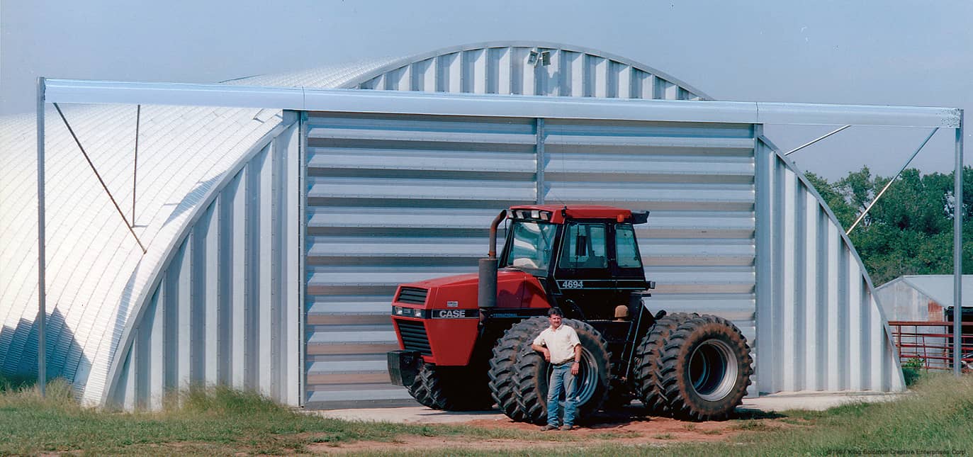 Q-model steel buildings storing a combine.